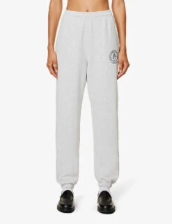 Lion Crest Brand-print Tapered-leg Relaxed-fit Stretch-cotton Jogging Bottoms -Sweaty Betty Store R04205111 HEATHERGREYNAVY ALT02