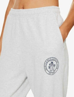 Lion Crest Brand-print Tapered-leg Relaxed-fit Stretch-cotton Jogging Bottoms -Sweaty Betty Store R04205111 HEATHERGREYNAVY ALT04