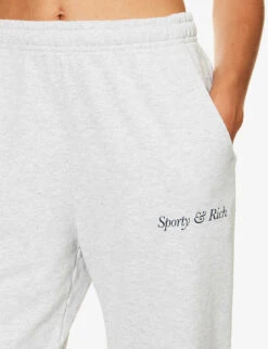 Italic Logo-print Relaxed-fit Stretch-cotton Jogging Bottoms 11 Italic Logo-print Relaxed-fit Stretch-cotton Jogging Bottoms -Sweaty Betty Store R04205136 HEATHERGRAYNAVY ALT04